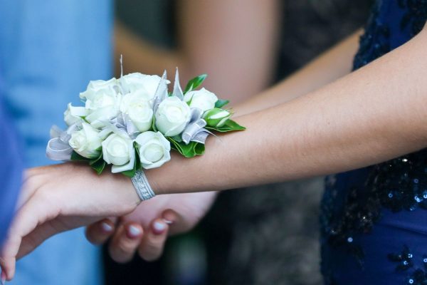 Beautiful prom girl and her corsage.